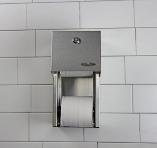 Wall-mounted Frost brushed stainless steel reserve roll toilet tissue dispenser with locking front cover for two standard toilet paper rolls.