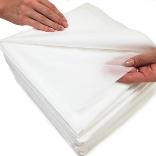 Hand lifting a HealthyLine disposable envelope cover from the stack
