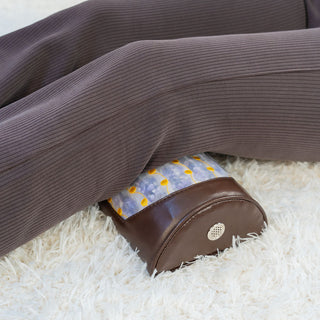 HealthyLine Amethyst Bolster placed under the knees
