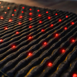 Close view of the red LED lights on the HealthyLine Jet mat
