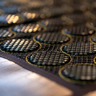 Close view of the round stones on the HealthyLine Mesh JT mat