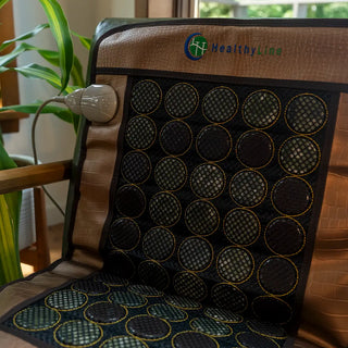Close view of the smaller HealthyLine Mesh JT mat on a chair