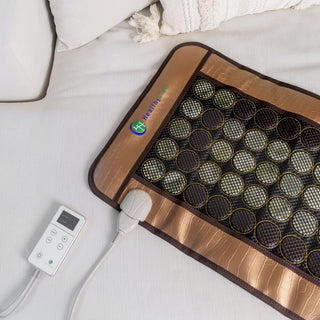 Smaller HealthyLine Mesh JT mat on a sofa with its controller