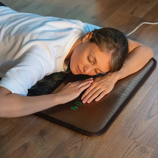 Woman resting face down on the HealthyLine Mesh JT mat