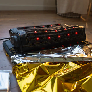 HealthyLine mylar blanket over a heating mat with a pillow