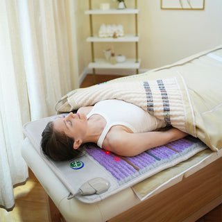 Person on a massage table inside the HealthyLine Platinum 360 Wrap Set