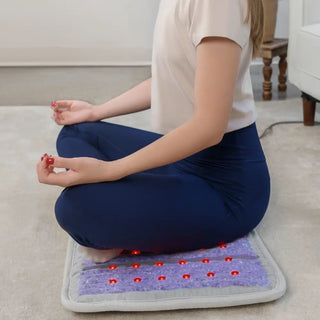 Person sitting cross-legged on a HealthyLine Platinum mat