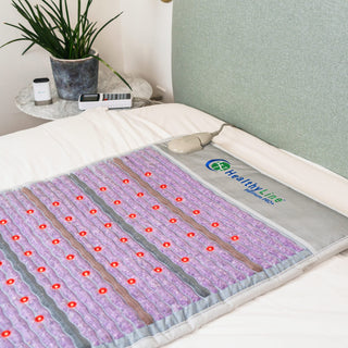 HealthyLine Platinum Pro Plus mat laid on a bed