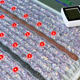 Close view of the HealthyLine Platinum Aura mat stones and red lights