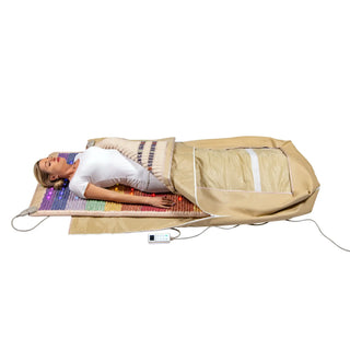 Person lying inside the HealthyLine Rainbow Chakra 360 Wrap Set on the floor