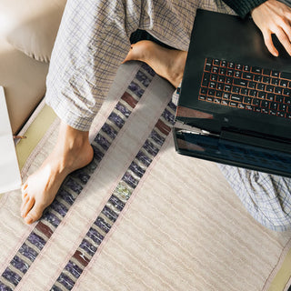Person using a laptop on the HealthyLine SOFT mat
