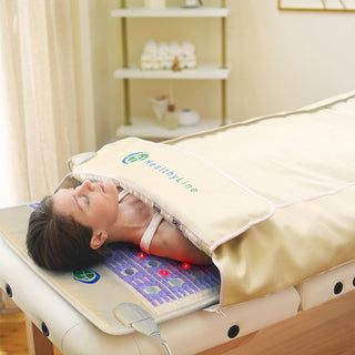 Person on a massage table inside the HealthyLine TAJ 360 Wrap Set