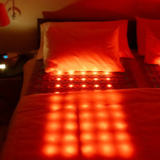 HealthyLine TAJ Bed with the red lights on in a bedroom
