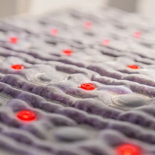 Close view of the lavender surface and red lights of the HealthyLine TAJ mat
