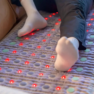 Feet on the HealthyLine TAJ mat with the red lights on