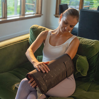 Woman holding the HealthyLine TAO Matrix pad on her arm