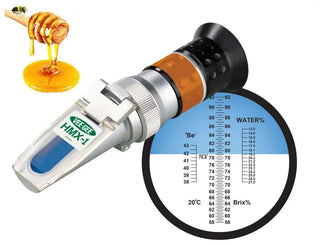 Heathrow Scientific 43006 Handheld Honey Refractometer with honey droplet and scale on a white background