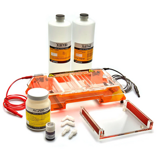 Chemical reaction setup with bottles, a container, and wires on a white background