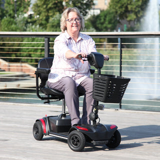 A person riding a Journey Adventure 08910 four-wheel scooter outdoors.