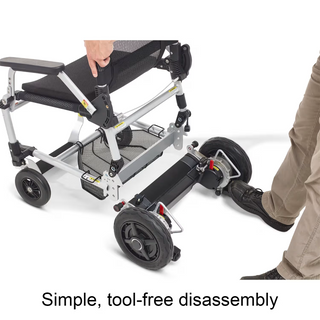 A person separating the seat section of the Journey Zoomer 09017 from its rear wheel frame without tools.