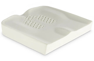 White contour pillow with honeycomb pattern on a white background