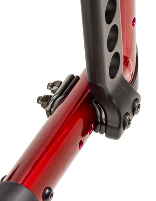 Close-up of a red and black bicycle frame on a white background