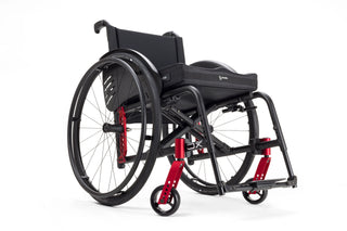 Ki Mobility Catalyst 5Vx Folding Manual Wheelcahir with red accents on a white background