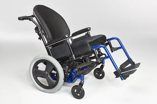 Ki Mobility Focus CR (E1161) Tilt Manual Wheelchair with a folded footrest on a white background