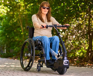 Woman using a Ki Mobility Klaxon Twist (E0986) outdoors with greenery in the background