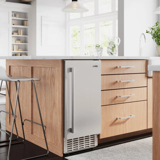 KoolMore KM-BIM66-NSS Built-in Residential Pearl Ice Nugget Maker integrated into a wooden kitchen island with white cabinets and decor.