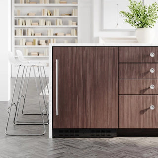 Modern kitchen with wooden KoolMore KM-BIR5C-PR Panel Ready Compact Refrigerator and a white countertop.