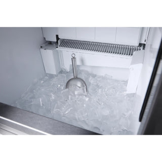 KoolMore KM-CIM100-CRSS Commercial/Residential Crescent Ice Maker with ice cubes and a scoop inside an ice machine.