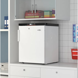 White KoolMore KM-PHF-4C Medical Freezer For Pharmacy/Laboratory in a laboratory setting with medical supplies on shelves above.