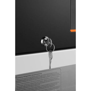 Key attached to a lock on a KoolMore KM-PHR-11C Medical Pharmacy Refrigerator, 11 cu. ft..