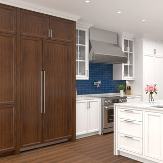 Modern kitchen with wooden cabinets, wooden KoolMore KM-PRC-R30 Panel Ready Refrigerator Column, white island, and blue backsplash.