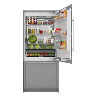 KoolMore KM-RER36-SWPR Panel Ready Refrigerator/Freezer with Ice Maker with open door displaying various food items on a white background