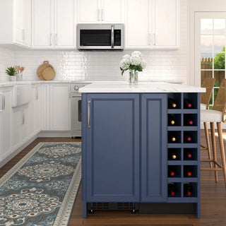 Kitchen with a blue KoolMore KM-BIR15-PR Built-In Panel Ready Undercounter Beverage Refrigerator featuring a wine rack, white cabinets, and a microwave.