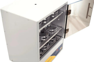Angled view of an LW Scientific incubator with the door open and petri dishes on the shelves