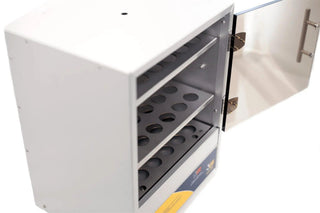 Angled view of an LW Scientific incubator with the door open showing the perforated shelf trays