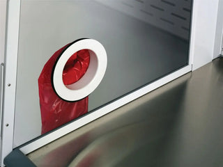 Red vacuum cleaner bag inside a  Labconco 5 Feet Protector XVS Ventilation Station Waste Chute gray compartment with a white rim.