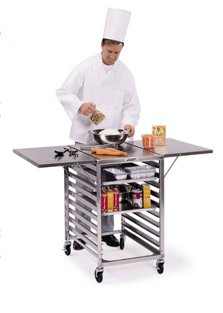 Chef preparing food on a Lakeside 110 Mobile Wing Table with 29 1/4 x 52 3/4 Inch Work Surface, 19 Pan Capacity kitchen cart with various items.