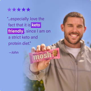 Customer holding a MOSH protein bar next to a written review