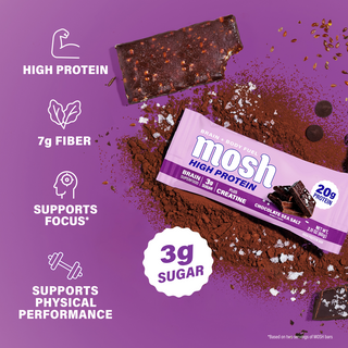 Unwrapped MOSH Chocolate Sea Salt bar on cocoa powder next to the brand's protein, fiber and sugar highlights