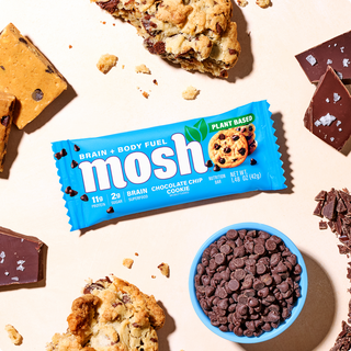 Wrapped MOSH Chocolate Chip Cookie Plant-Based Protein Bar surrounded by its flavor ingredients