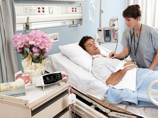 Masimo Radical-7 Medical Equipment in use with adult patient in clinical setting
