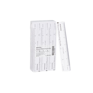 White McKesson 871649_CS Wound Measuring Guide Metric / English Paper 6 Inch with ruler on a white background