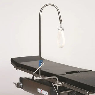Medical examination table with a MidCentral MCM-150 Candy Cane Stirrup on a white background