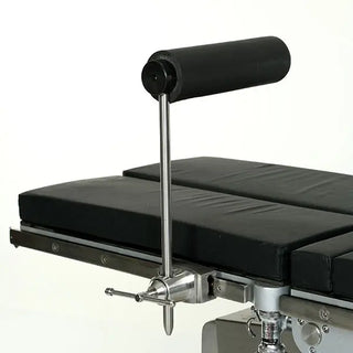 Black medical examination table with a MidCentral MCM-612 Total Knee Replacement Support on a white background
