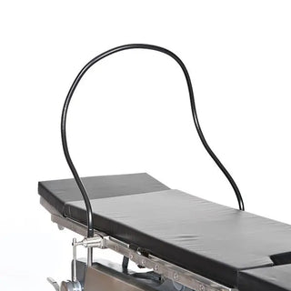 Medical examination table with a curved MidCentral MCM106 Malleable Anesthesia Screen on a white background