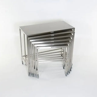 Set of six stainless steel MidCentral Nesting Tables on a white background